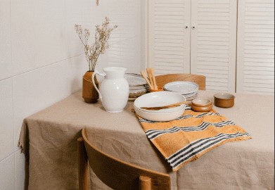 Dining table set with linen and ceramics